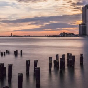 Sunset over New York and the Statue of Liberty New York Landscapes Architecture