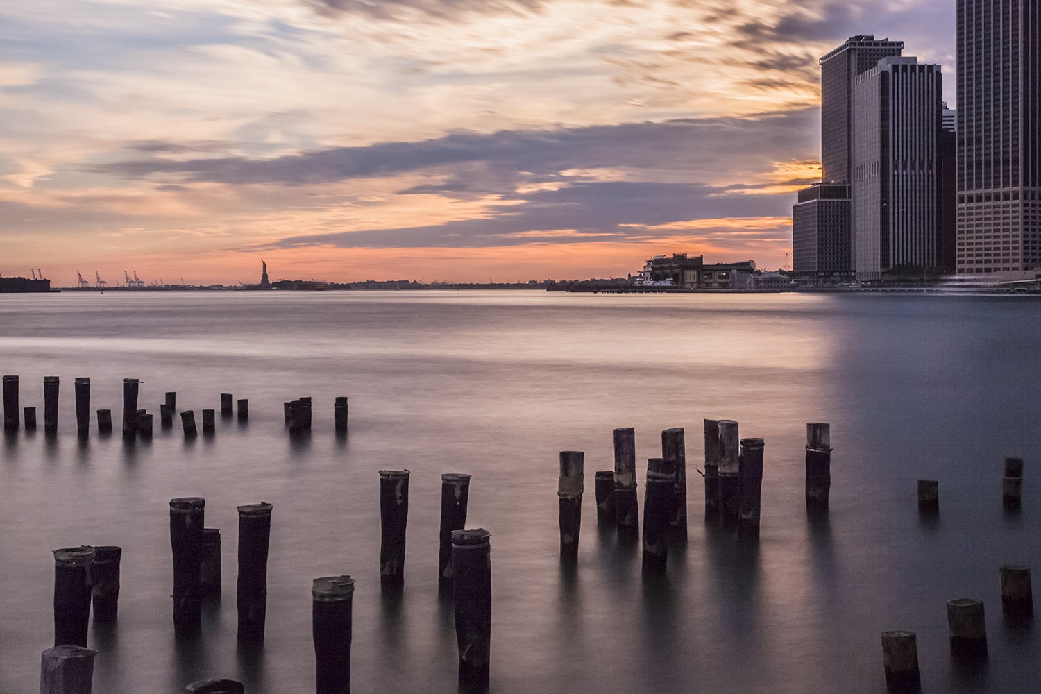 Sunset over New York and the Statue of Liberty New York Landscapes Architecture