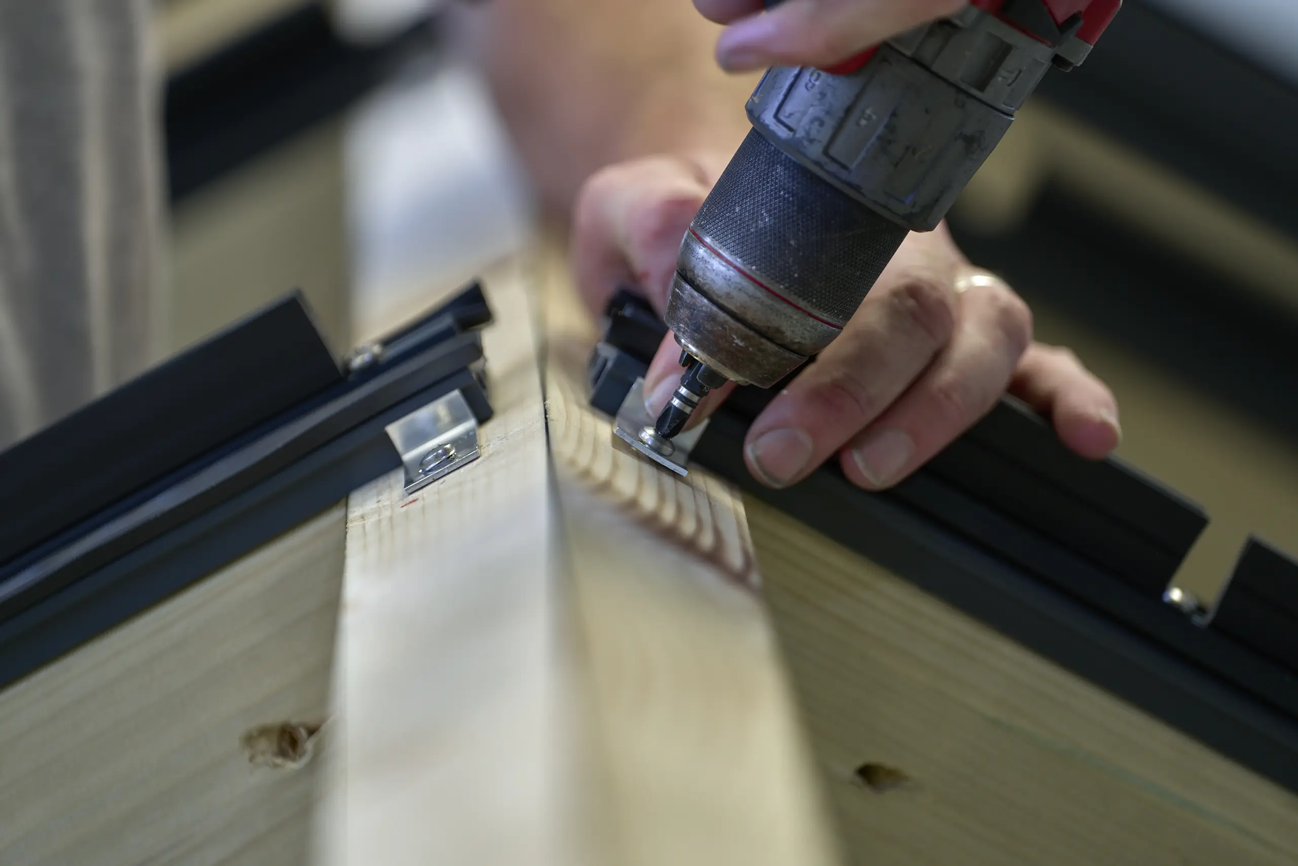 Component fixing - Securing brackets to timber structures as part of glazing assembly.