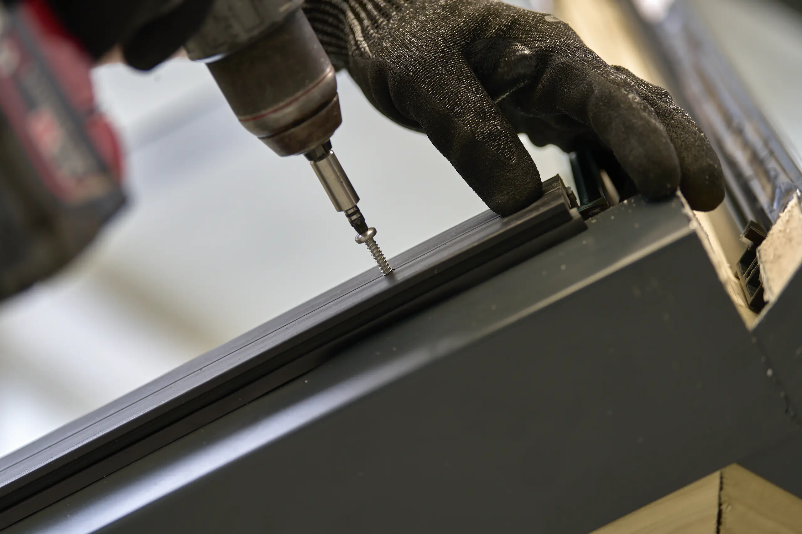 Precision assembly - Fixing aluminium glazing components into position during frame assembly.Fixing aluminium glazing components into position during frame assembly.