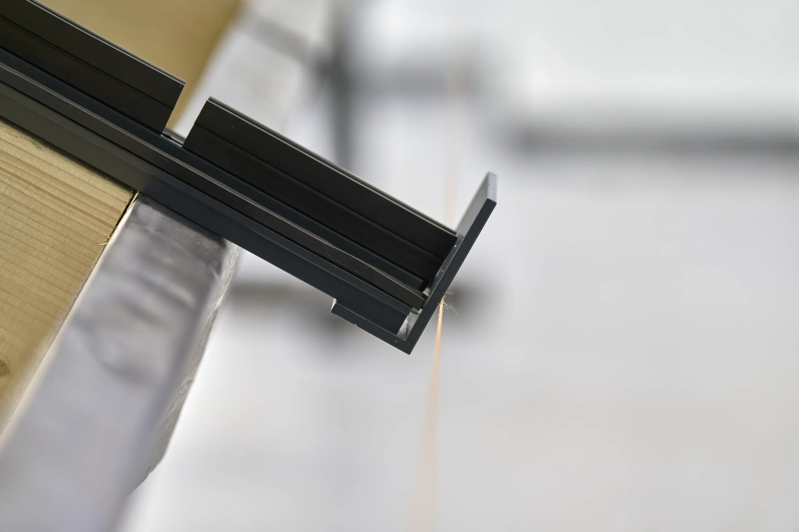 Glazing frame section - Architectural glazing profile detail showing clean lines and engineering precision.